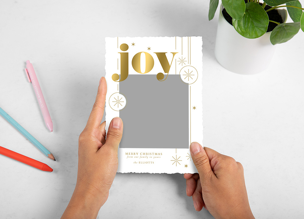 Whcc holiday card Joy bold sparkles Styled With Pens and Plant Model2 preview