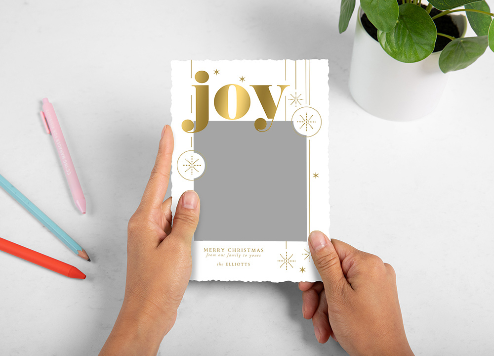 Whcc holiday card Joy bold sparkles Styled With Pens and Plant Model2 preview
